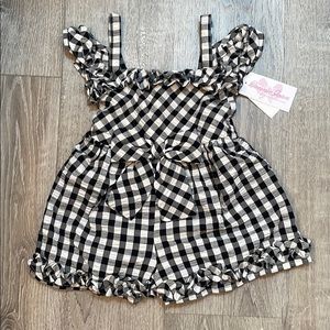 New w tags. Black/white checked romper. Size 6X.